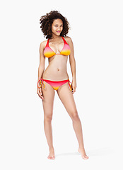 Image showing Portrait, black woman and bikini in studio for summer, vacation and fun while posing on white background space. Model, swimwear and girl from Jamaica standing confident, proud and cool isolated