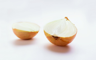 Image showing Onion half, vegetable and healthy food in studio for nutritionist food, meal or organic lunch. Cooking, wellness diet and nutrition with cut, chopped or vegan ingredient isolated on white background