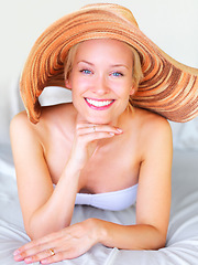 Image showing Relax, bikini and portrait of woman on sunbed at hotel for sunbathing, summer and tropical Bali vacation. Villa, resort and spa with girl lounge for wellness, travel destination and luxury on trip