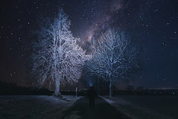 Image showing Silhouette of hiker person with flashlight