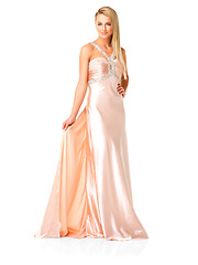 Image showing Beautiful, elegant and fashion in a fancy dress or evening gown for prom, formal event or ball against white studio background. Confident woman wearing bridesmaid clothing for wedding party