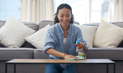 Image showing Happy woman, cleaner and spray bottle, wipe table with detergent and chemical disinfectant with housekeeping. Spring cleaning, service and female housekeeper with smile, liquid soap and clean house