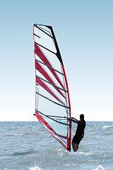 Image showing Silhouette of a windsurfer on waves of a sea 2 