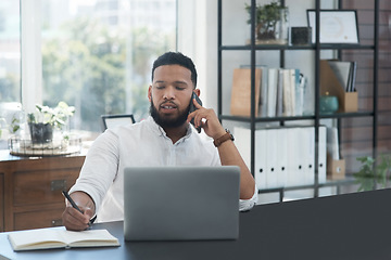 Image showing Laptop, phone call and notebook with a business man at his desk in the office for communication or networking. Computer, mobile and writing with a male employee working online for company negotiation