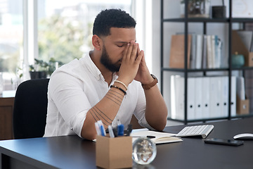 Image showing Stress, burnout and tired with a business man at his desk in an office feeling the pressure of a project deadline. Headache, fatigue and frustrated with an exhausted male employee overwhelmed by work