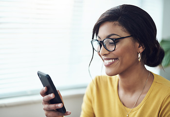 Image showing Phone, typing and happy woman reading online, social media post or networking on internet for job search. Creative, communication and african person in glasses, texting on mobile app or chat at home