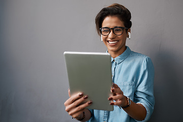 Image showing Happy woman, tablet and listening to music isolated on gray background for university e learning, streaming and video. Gen z person or student on digital technology, audio and electronics application