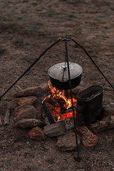 Image showing Preparing food on campfire