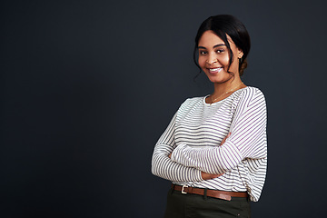 Image showing Smile, mockup and portrait of a young woman arms crossed isolated in a black background studio with casual style. Happiness, happy and African female person feeling confident in her fashion