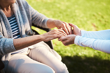 Image showing Senior woman, caregiver and holding hands in care, support or love for healthcare or life insurance. Hand of nurse helping mature patient in wheelchair or person with a disability at nursing home