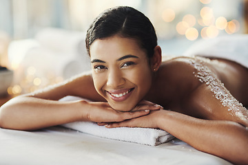 Image showing Happy woman, face and portrait at spa for massage, skincare or beauty in relax body treatment. Calm female lying in relaxation on bed with smile for back exfoliation, zen therapy or wellness at salon