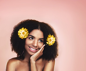 Image showing Happy woman, thinking and flowers for hair care, beauty and studio background with mockup of natural skincare. Face, african model and daydream with floral plants, afro and sustainable cosmetic ideas