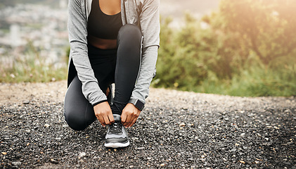 Image showing Closeup, exercise and woman outdoor, tie shoes and training with fitness, workout goal and target. Female person, athlete and runner with marathon, practice and sports with wellness, start and health