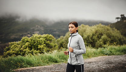 Image showing Nature, running and Indian woman training, cardio or workout goal with progress, energy or fitness. Female person, athlete or runner outdoor, mountain view or focus with exercise, sports or wellness