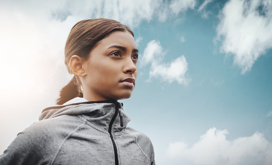 Image showing Sky, runner and Indian woman with focus, training and exercise with workout goal, target and balance. Female person, mockup space and athlete with wellness, concentration and energy with cardio