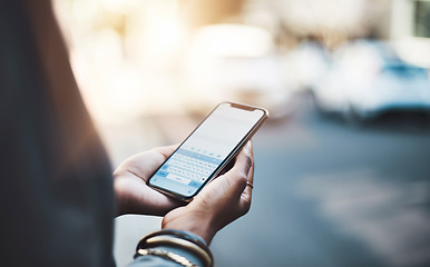 Image showing Woman, hands and phone screen in city for communication, social media or texting outdoors. Hand of female on mobile smartphone keypad display for travel, networking or chatting in urban town street