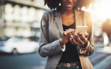 Image showing Business woman, hands and phone in city for communication, social media or texting outdoors. Hand of happy female professional, smile and chatting, browsing or networking in street of an urban town