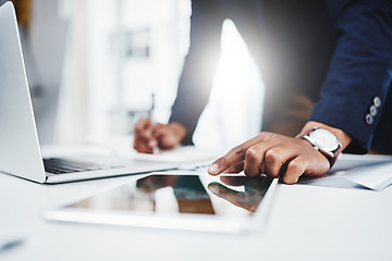 Image showing Professional, man and laptop for research on tablet at work for analysis about career at desk. Businessman, hand and email for online at a workplace with a digital screen for communication on web.