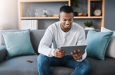 Image showing Online shopping, tablet and credit card, happy man on sofa reading website discount sale info or promotion. Happiness, internet and payment, male with smile on face and ecommerce subscription service