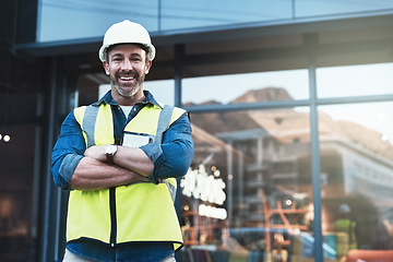 Image showing Engineer, portrait of man architect standing in front of construction site and arms crossed. Industrial or architecture, project or management and happy mature male worker with safety helmet