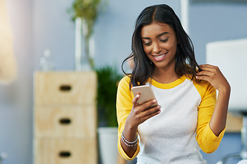 Image showing Home communication, phone and happy woman typing, texting and search online, internet or app website. Smile, happiness and Indian person on cellphone, mobile application and message social media user