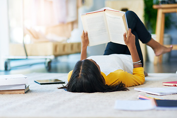 Image showing Books, learning student and woman reading literature, research or history book for home school education. College scholarship, university study and person studying knowledge while relax on floor