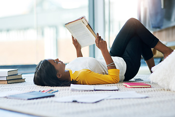 Image showing Books, relax student and woman reading literature, research or book for home school education, study or college. Learning commitment, university and person studying knowledge while lying on floor