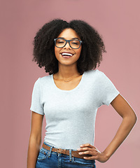 Image showing Portrait, funny and black woman with glasses in studio isolated on a pink background akimbo. Natural beauty, nerd and face of African female model from Nigeria with confidence, cosmetics and fashion.