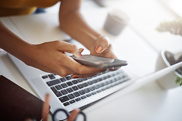 Image showing Woman, hands and office phone at a laptop for work networking and employee typing. Female worker, table and social network app with mobile communication and text for professional and web connection