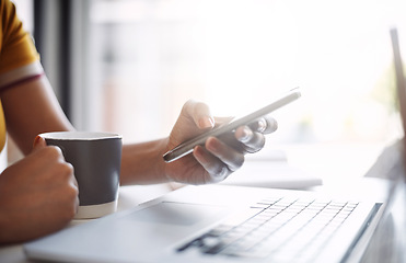 Image showing Hands, closeup and scrolling on smartphone with keyboard, coffee and work in home office or shopping, browsing and mobile communication. Woman, social media, and internet or online search with laptop