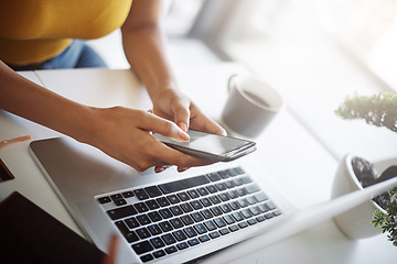 Image showing Woman, hands and phone online at a laptop for work networking and employee typing. Female worker, table and social network app with mobile communication and text for professional and web connection