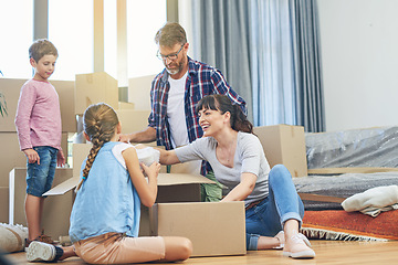 Image showing Children, parents and boxes at new home for an investment for a lifestyle with happiness. Family, child and apartment moving box with smile in living room with love and being happy in modern house.