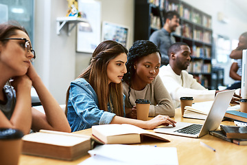 Image showing Laptop, library and university girl students studying together for education in preparation of a test or exam. Computer, college and scholarship with female friends searching for information online