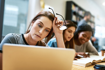 Image showing Woman, stress and laptop for studying at library, college or campus with tired face, anxiety or burnout. University student, girl and computer for education, study and fatigue at school with reading