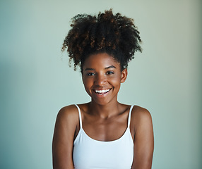 Image showing Smile, youth and portrait of black woman on studio background with afro, happiness and skincare. Beauty, dermatology and happy African girl, model with mockup, natural cosmetics and beautiful face.