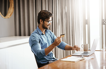 Image showing Happy man, credit card and laptop in work from home office, online shopping and fintech payment of budget. Male person, computer and ecommerce banking for finance, investment and internet transaction