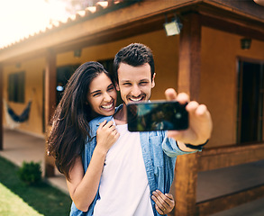 Image showing Happy couple, hug and smile for selfie, photo or profile picture together and social media vlog outdoors. Man and woman hugging and smiling for memory, online post or capture with phone outside home