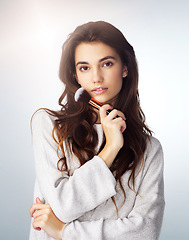Image showing Face brush, natural makeup and beauty of a woman in studio with a glow. Portrait of a female model person on a grey background for cosmetology, facial powder and cosmetic tools or skin care