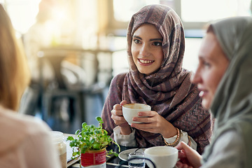 Image showing Friends, smile and Muslim women in coffee shop, bonding and talking together. Cafe, happy and Islamic girls, group or people chatting, conversation and discussion for social meeting in restaurant.