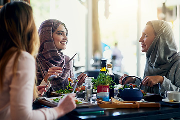 Image showing Muslim women, friends and lunch in restaurant, together and talking with food, smile and happiness. Islamic woman, group and eating brunch with conversation, happy face and listen with food in cafe