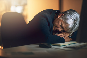 Image showing Burnout, night and businesswoman sleeping in the office to complete a deadline project. Exhausted, tired and mature professional female employee taking a nap while working overtime in the workplace.