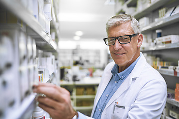 Image showing Pharmacy, medicine and portrait of man at shelf in drug store for thinking, inspection and inventory. Medical, healthcare and pills with male pharmacist in clinic for expert, wellness and product