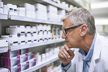 Image showing Pharmacy, medicine and thinking with man at shelf in drug store for search, inspection and inventory. Medical, healthcare and pills with senior male pharmacist for expert, wellness and product