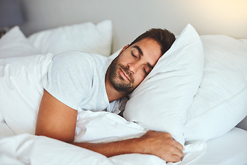 Image showing Man, sleeping and bed in morning rest for healthy wellness, peace and quiet on comfort pillow at home. Tired or exhausted male person asleep or dreaming on peaceful holiday or weekend in the bedroom