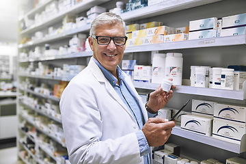 Image showing Pharmacy, medicine and tablet with portrait of man at shelf in store for stock, inspection and inventory. Medical, healthcare and pills with senior pharmacist for technology, wellness and product