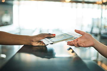 Image showing Hands, passport and airport service counter closeup or boarding flight, support and travel desk consultant. Travelling agent, checkin and person help traveller with id book, ticket and safe journey