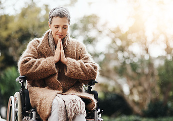 Image showing Senior woman in wheelchair, praying outdoor with worship and God with peace, disability with gratitude and faith. Spiritual female person in nature, mockup space and paralysis, disabled and prayer