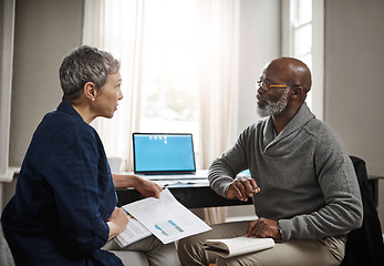 Image showing Laptop, documents and accounting with a senior couple busy on a budget review in the home together. Finance, taxes or investment planning with a mature man and woman looking at insurance or savings