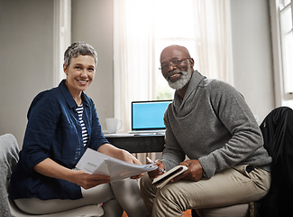 Image showing Portrait, documents or finance with a senior couple busy on a budget review in the home together. Accounting, taxes or investment planning with a mature man and woman looking at insurance or savings