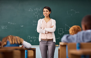 Image showing Portrait, woman and teacher in a classroom, arms crossed and education with happiness, employment and career. Face, female person and employee with skills, maths and smile with educator and knowledge